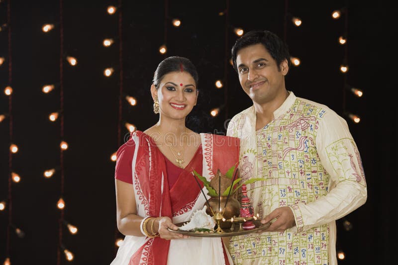 Bengali couple praying stock image. Image of indoors - 36256375