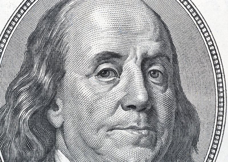 US President Benjamin Franklin portrait on one hundred dollar bill fragment macro. US President Benjamin Franklin portrait on one hundred dollar bill fragment macro