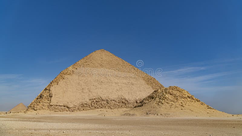 The Bent Pyramid is an ancient Egyptian pyramid located at the royal necropolis of Dahshur, approximately 40 kilometres south of royalty free stock images