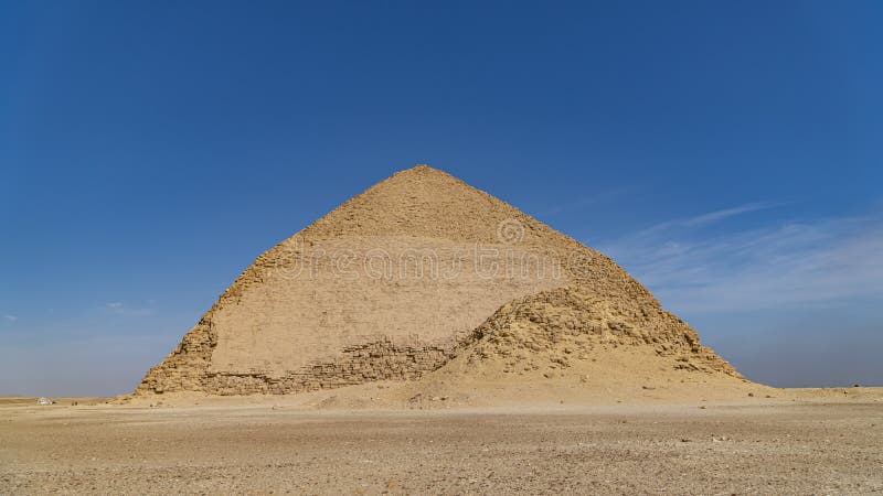 The Bent Pyramid is an ancient Egyptian pyramid located at the royal necropolis of Dahshur, approximately 40 kilometres south of stock photography