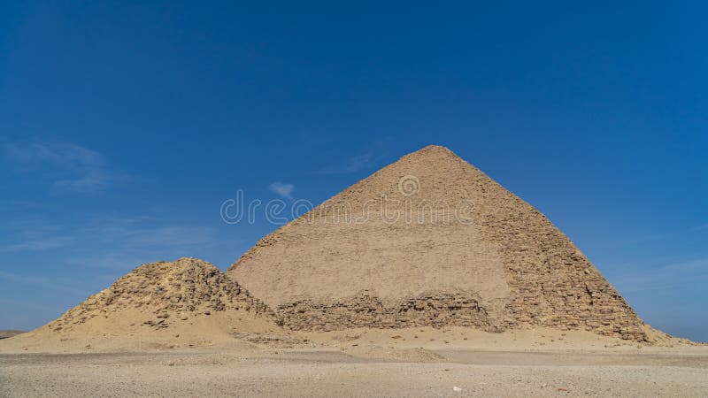 The Bent Pyramid is an ancient Egyptian pyramid located at the royal necropolis of Dahshur, approximately 40 kilometres south of royalty free stock photography