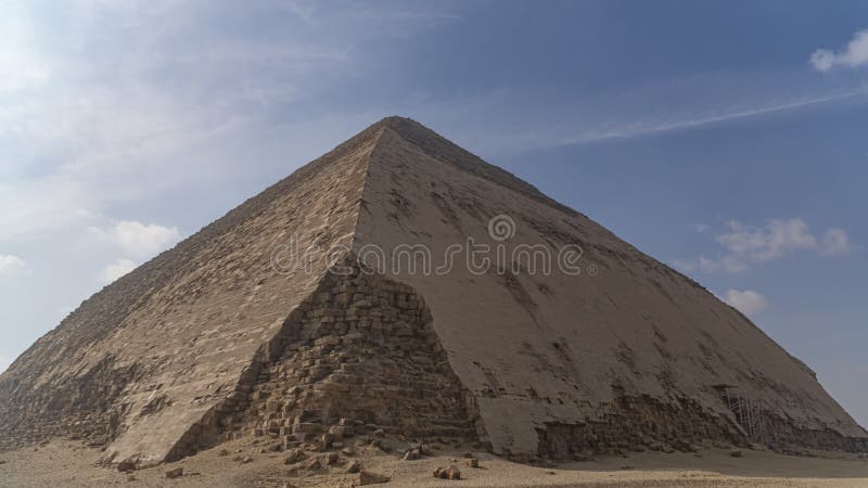 The Bent Pyramid is an ancient Egyptian pyramid located at the royal necropolis of Dahshur, approximately 40 kilometres south of royalty free stock images