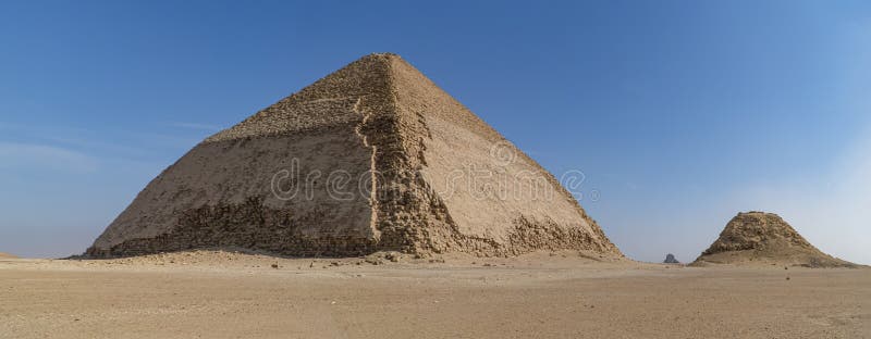 The Bent Pyramid is an ancient Egyptian pyramid located at the royal necropolis of Dahshur, approximately 40 kilometres south of stock photo