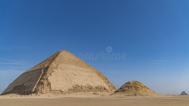 The Bent Pyramid is an ancient Egyptian pyramid located at the royal necropolis of Dahshur, approximately 40 kilometres south of stock photo