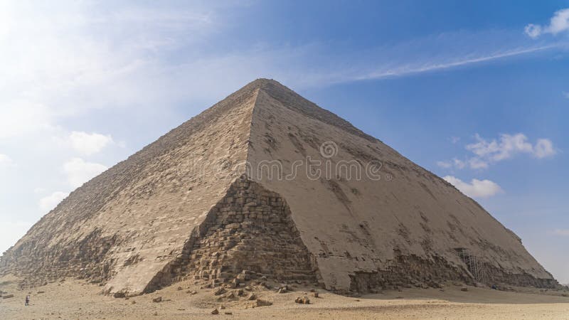 The Bent Pyramid is an ancient Egyptian pyramid located at the royal necropolis of Dahshur, approximately 40 kilometres south of stock images