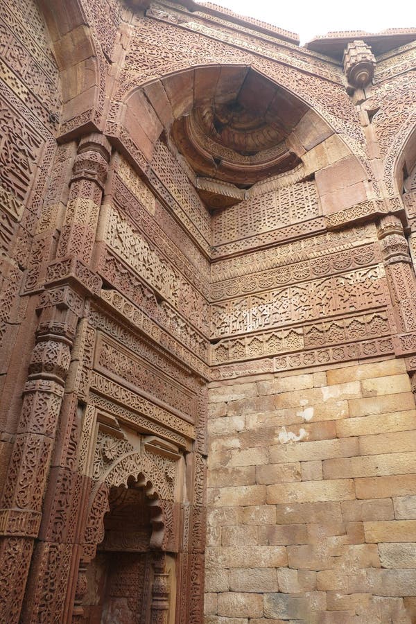 Elaborate carvings at ruins of the Tomb of slave dynasty sultan Iltutmish from 13th century, Qutb Minar complex, Delhi, India. Elaborate carvings at ruins of the Tomb of slave dynasty sultan Iltutmish from 13th century, Qutb Minar complex, Delhi, India