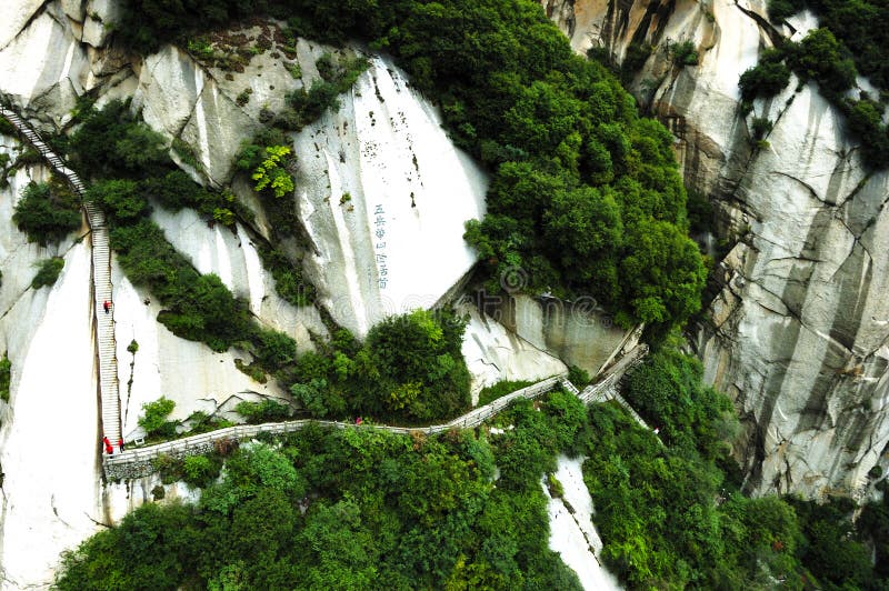 The steepest sacred mountain in central China, the Hua mountain is located 120 kilometers (75 miles) east of the city of Xi'an. Traditionally called the West Mountain, it is well known for steep trails, breath-taking cliffs, narrow passages, and grand sceneries. The steepest sacred mountain in central China, the Hua mountain is located 120 kilometers (75 miles) east of the city of Xi'an. Traditionally called the West Mountain, it is well known for steep trails, breath-taking cliffs, narrow passages, and grand sceneries.