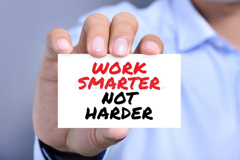 WORK SMARTER NOT HARDER, motivational text message on the card shown by a man. WORK SMARTER NOT HARDER, motivational text message on the card shown by a man