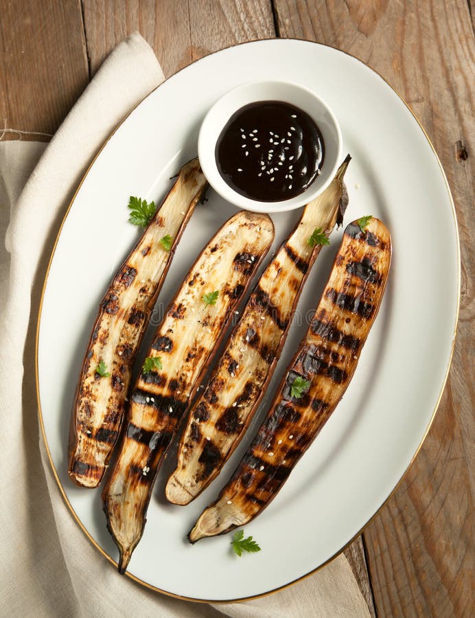 Grilled Asian long eggplant with Hoisin sauce on plate. Grilled Asian long eggplant with Hoisin sauce on plate