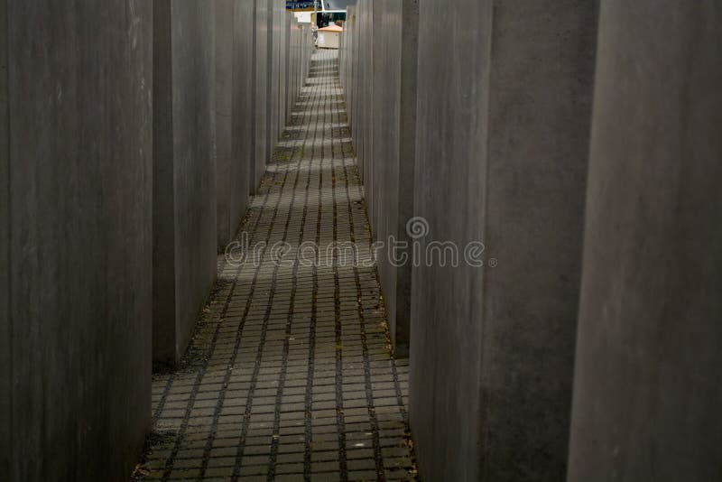 14.05.2019. Berlin, Germany. Holocaust monument. View in the field from concrete slabs of the different size and height. City sigh stock photo 14.05.2019. Berlin, Germany. Holocaust monument. View in the field from concrete slabs of the different size and height. City sigh stock photo
