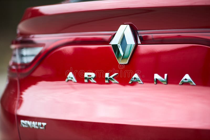 Berlin - March 2022: 2021 Renault Arkana e-Tech hybrid SUV car Renault and Arkana logo selective focus car detailing