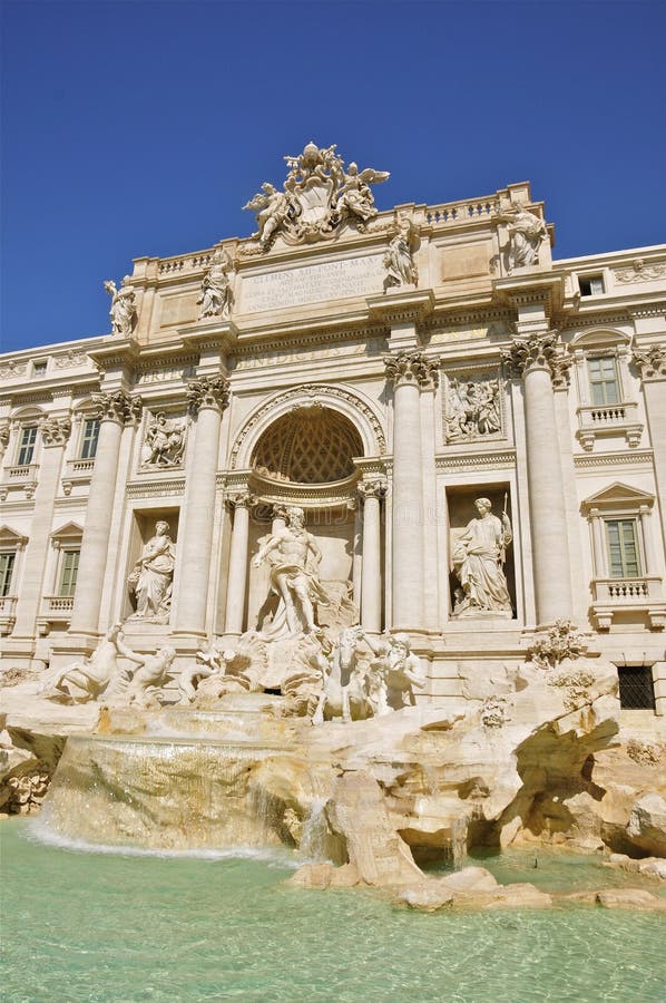 Trevi Fountain and Palazzo Poli, Rome. Bernini and Salvi`s Trevi Fountain and Palazzo Poli on Piazza di Trevi, Rome; in portrait mode stock images Trevi Fountain and Palazzo Poli, Rome. Bernini and Salvi`s Trevi Fountain and Palazzo Poli on Piazza di Trevi, Rome; in portrait mode stock images