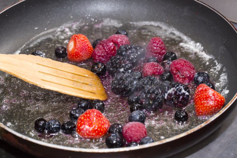 Berries cooking in a pan