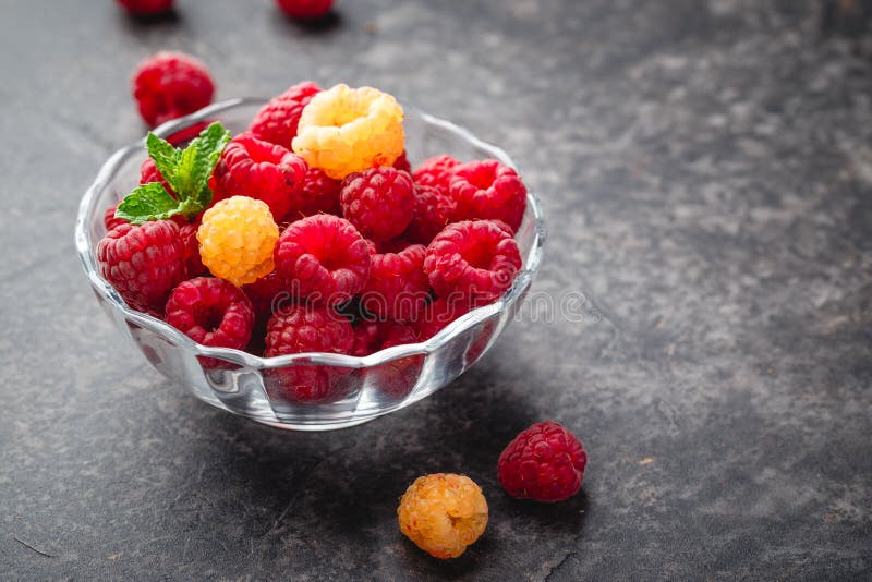 Berries red and yellow raspberries stock image