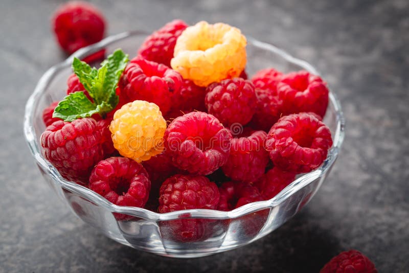 Berries red and yellow raspberries royalty free stock images
