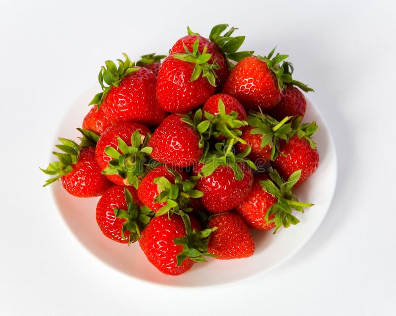 Berries of a strawberry on a white plate. royalty free stock image Berries of a strawberry on a white plate. royalty free stock image