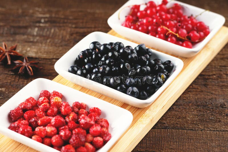 Berry fruits in a dishes stock photo. Image of fruit 76680264