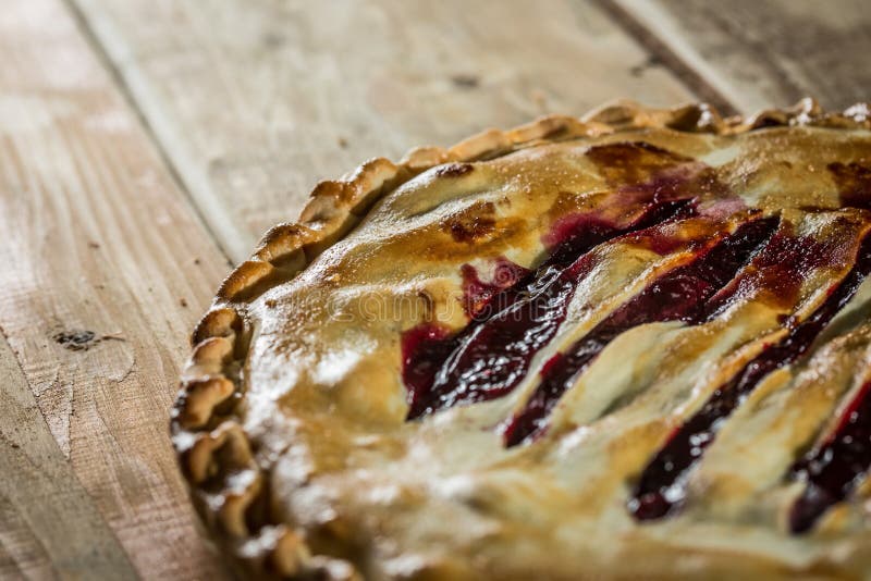 Berry pie with blueberries close-up on a plate on the table. horizontal royalty free stock image Berry pie with blueberries close-up on a plate on the table. horizontal royalty free stock image