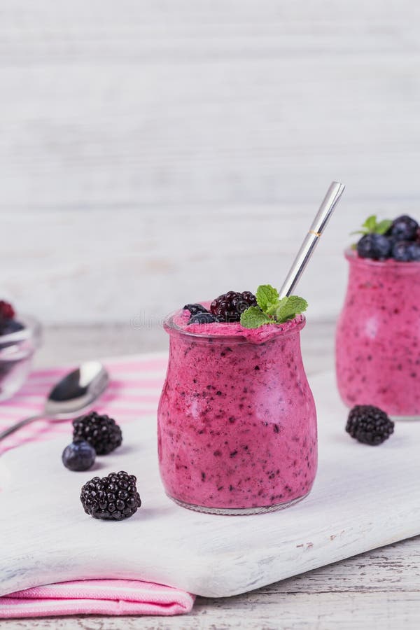 Berry smoothie, healthy detox yogurt drink, diet or vegan food c royalty free stock image Berry smoothie, healthy detox yogurt drink, diet or vegan food c royalty free stock image