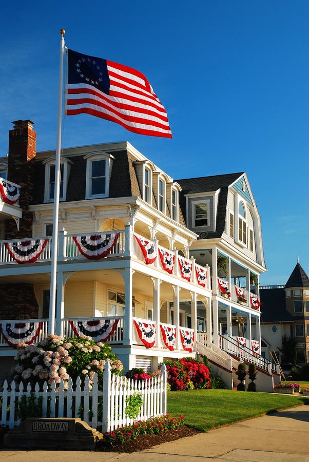 The Colonial flag and red, white and blue bunting Fourth of July Decorations in Ocean Grove NJ. The Colonial flag and red, white and blue bunting Fourth of July Decorations in Ocean Grove NJ