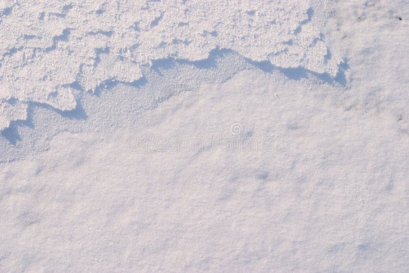 Texture of the snow. Thin snow crust on the surface of the frozen lake. Natural sunlight emphasizes texture. Pattern # 5. Texture of the snow. Thin snow crust on the surface of the frozen lake. Natural sunlight emphasizes texture. Pattern # 5