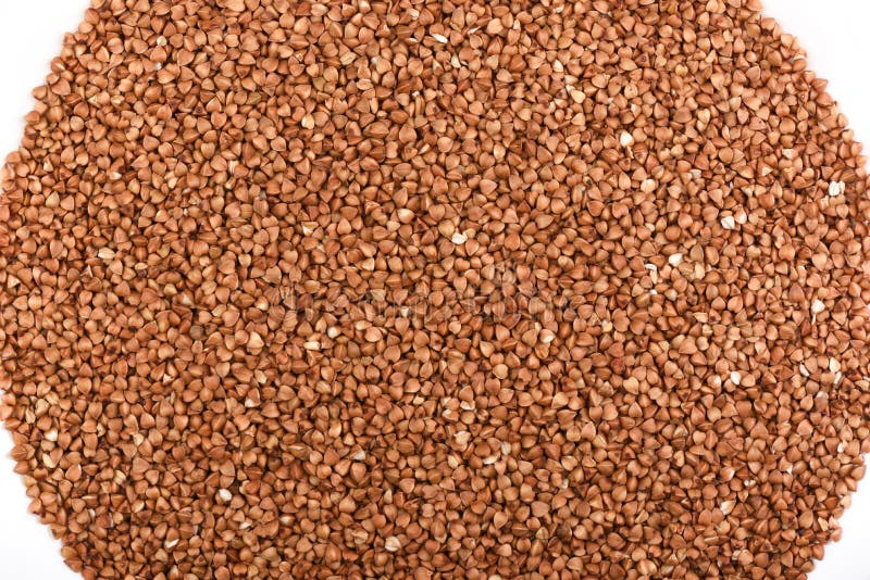 Beschneidungspfad eingeschlossen Buchweizen auf einem weißen Hintergrund Abstrakter Nahrungsmittelhintergrund lizenzfreie stockfotos Beschneidungspfad eingeschlossen Buchweizen auf einem weißen Hintergrund Abstrakter Nahrungsmittelhintergrund lizenzfreie stockfotos