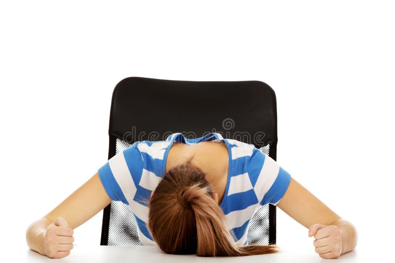 Worried teenage woman sleeping at the desk. Worried teenage woman sleeping at the desk.