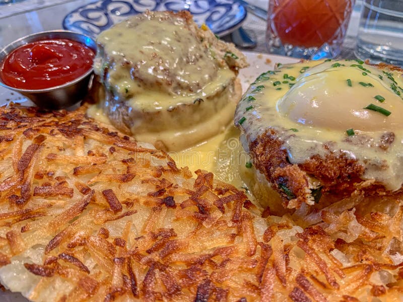 The best breakfast - eggs Benedict with hash brown - image
