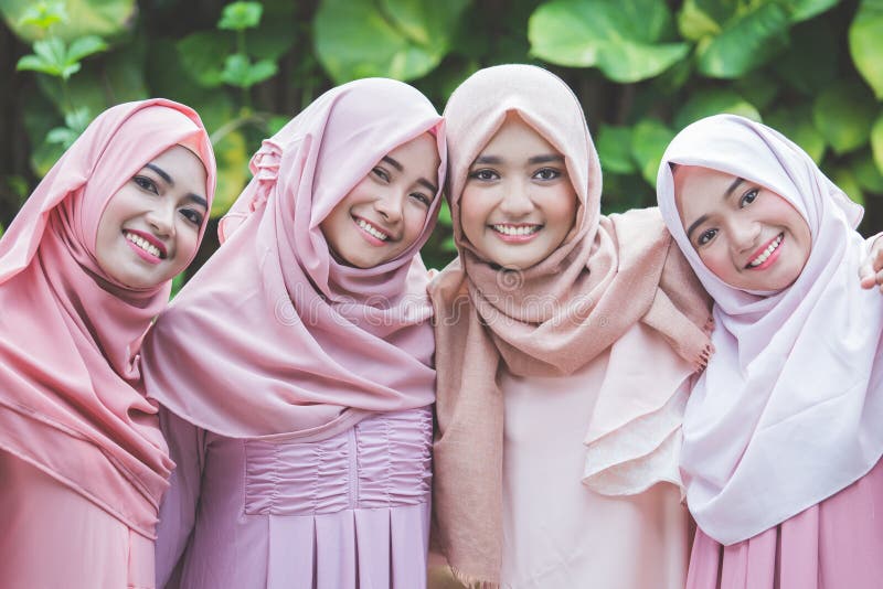 A Young Muslim Woman Reading a Book Stock Photo - Image of student ...