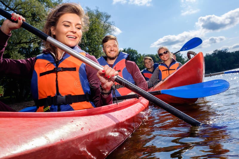 Best friends having fun on a kayaks