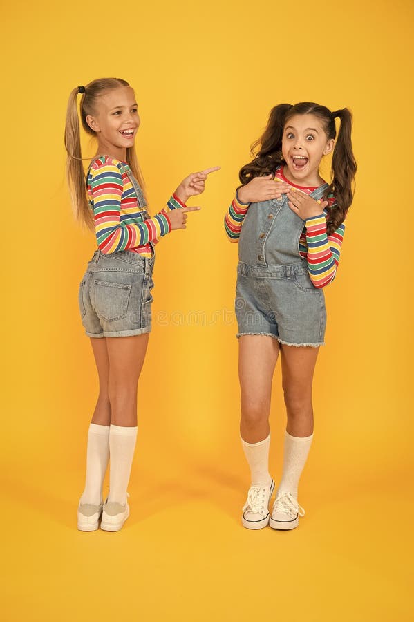 Best friends. Modern fashion. Kids fashion. Little girls wearing rainbow clothes. Happiness. Girls long hair. Cute