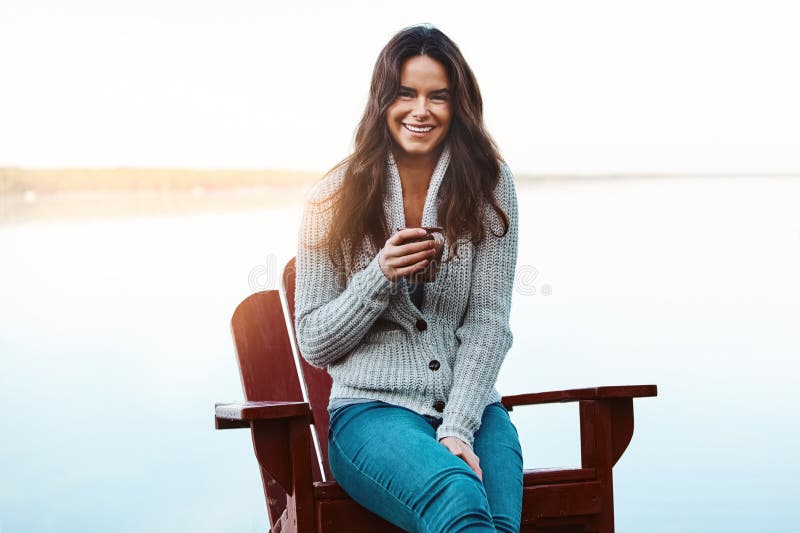 This is the best place to find yourself. an attractive young woman relaxing while on vacation. stock photography