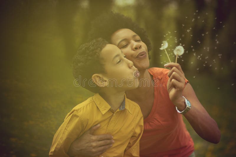 Best wishes. Mother and son in the park