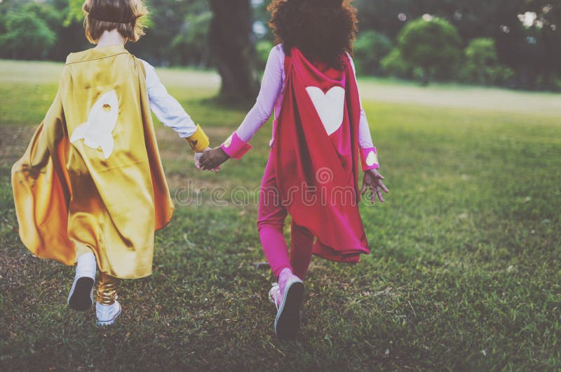Bestfriends Superhero Little Girls Walking Concept stock photo Bestfriends Superhero Little Girls Walking Concept stock photo