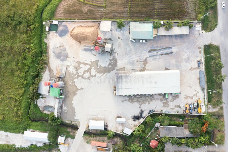 Concrete plant or batching plant in top view. Building and equipment for production ready mix concrete by mix aggregate material i.e. cement, water, sand, rock or gravel for construction work. Concrete plant or batching plant in top view. Building and equipment for production ready mix concrete by mix aggregate material i.e. cement, water, sand, rock or gravel for construction work