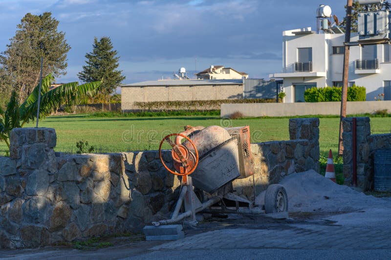 a concrete mixer stands on the street in the village 1. a concrete mixer stands on the street in the village 1