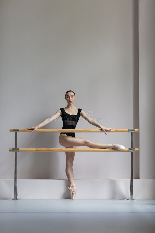 Beuatiful ballerina training in the class stock photography