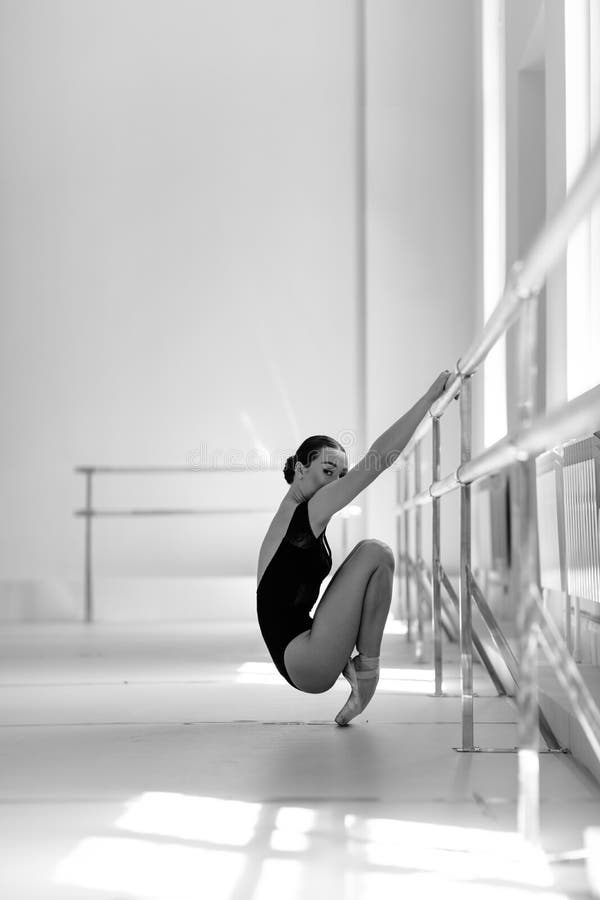 Beuatiful ballerina training in the class stock photography