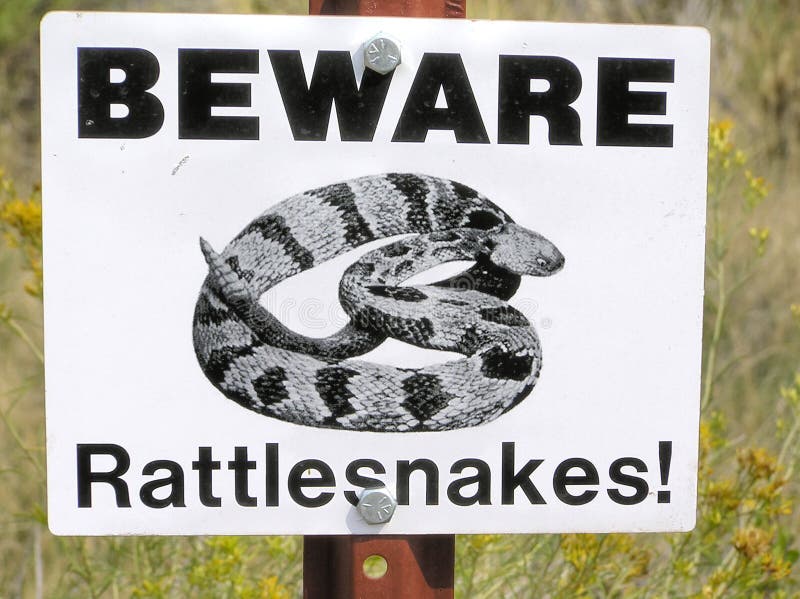 Beware of rattlesnakes signpost in the Badlands, South Dakota