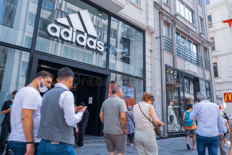 Adidas Turkish Store in Taksim Territory and Some Costumers Buying Clothes  and Others Walking on Istiklal Independence Street Editorial Photography -  Image of famous, mall: 233618272