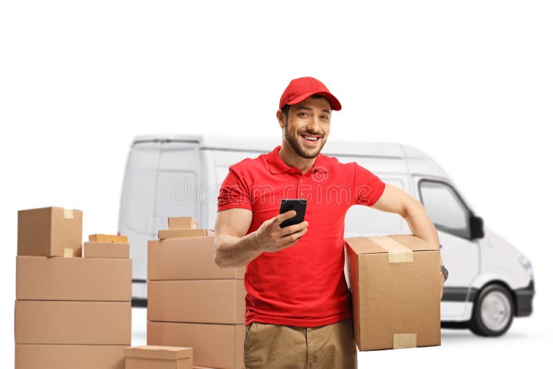 Delivery guy with a box and a mobile phone smiling at the camera in front of a white van isolated on white background. Delivery guy with a box and a mobile phone smiling at the camera in front of a white van isolated on white background