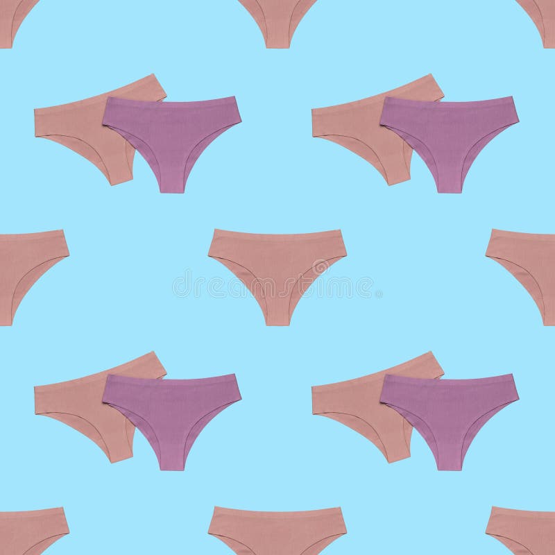 Seamless pattern from a set of women`s panties on a blue background. The concept of women`s underwear. Flat lay. Seamless pattern from a set of women`s panties on a blue background. The concept of women`s underwear. Flat lay