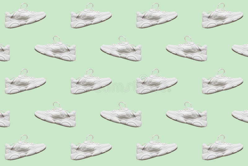 Seamless regular pattern of light colored casual sneakers on a mint background. Photo collage. Fashion blog, sport lifestyle. Printing on fabric, wrapping paper. Seamless regular pattern of light colored casual sneakers on a mint background. Photo collage. Fashion blog, sport lifestyle. Printing on fabric, wrapping paper