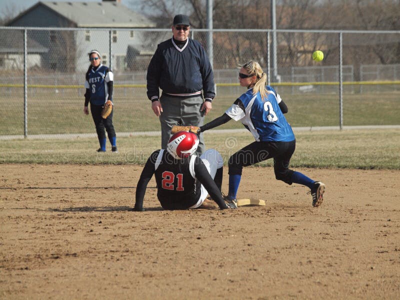 Action at Waukesha West High School. The Varsity Girls Wolverines fast pitch softball team played against Waukesha South High School Varsity Girls . This was the first season home game for Waukesha West. Waukesha West won 4-2. Second baseman trying to tag out the runner, but dropped the ball. Action at Waukesha West High School. The Varsity Girls Wolverines fast pitch softball team played against Waukesha South High School Varsity Girls . This was the first season home game for Waukesha West. Waukesha West won 4-2. Second baseman trying to tag out the runner, but dropped the ball.