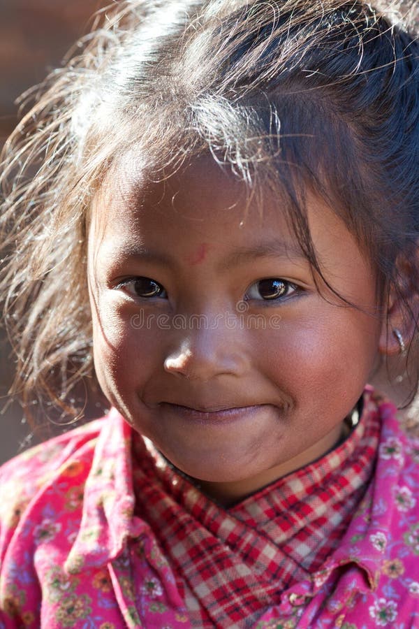 Nepalese girl playing at Durbar square in Bhaktapur, Nepal royalty free stock photos Nepalese girl playing at Durbar square in Bhaktapur, Nepal royalty free stock photos