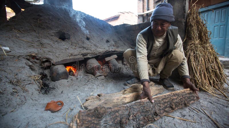 BHAKTAPUR, NEPAL - Nepalese man working in the his pottery workshop. royalty free stock photos