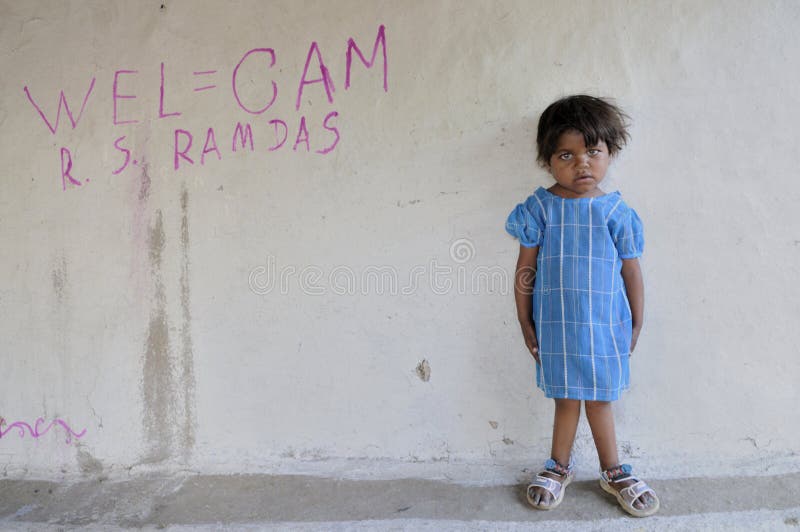 BHOPAL- NOVEMBER 14: 7years old Meenakshi suffering from Osteoporosis-a disease in her bones standing in front of her house in Bhopal - India on November 14, 2010.