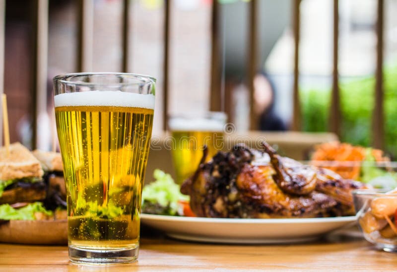 Beer. Dining Concept,With Chicken roasting,salad French fries on wooden table. Beer. Dining Concept,With Chicken roasting,salad French fries on wooden table