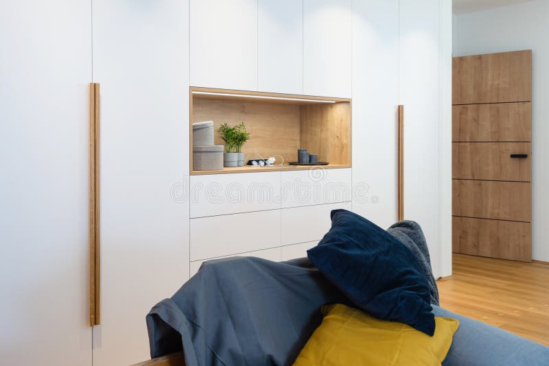 White wooden closet in bedroom of modern house. White wooden closet in bedroom of modern house