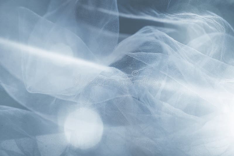 White tulle fantasy background with light flare. White tulle fantasy background with light flare